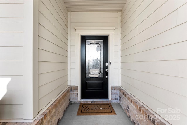 entrance to property with stone siding