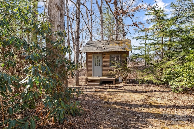 view of outbuilding with entry steps and an outbuilding