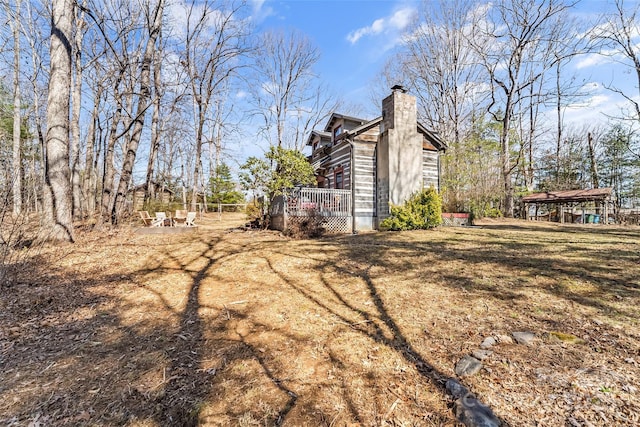 view of yard featuring a wooden deck