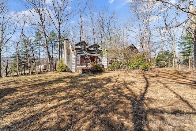 view of home's exterior featuring a chimney