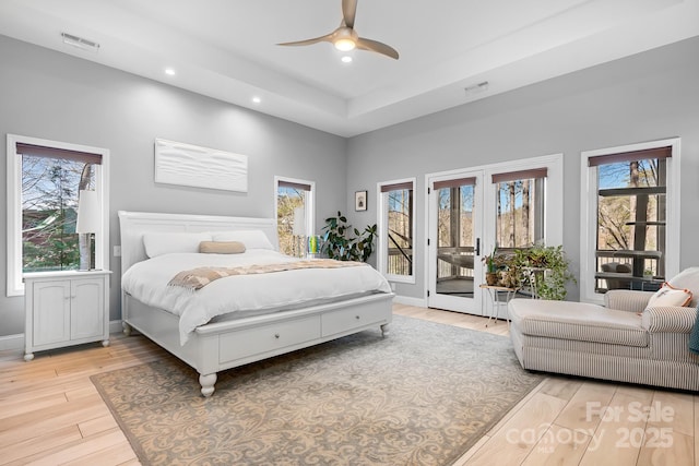 bedroom with access to outside, recessed lighting, visible vents, light wood-type flooring, and baseboards