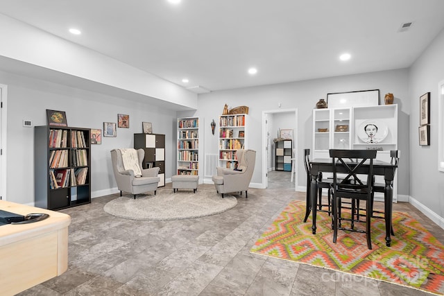 interior space featuring baseboards, visible vents, and recessed lighting