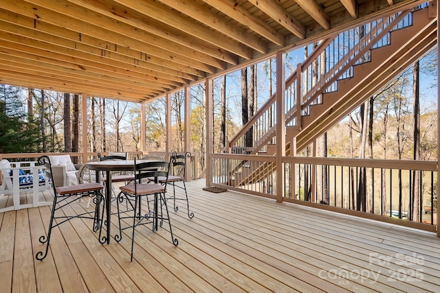 wooden terrace featuring outdoor dining space