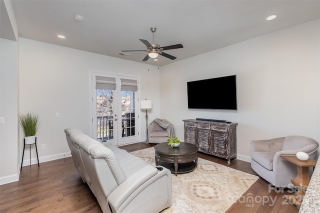 living room with french doors, visible vents, dark wood finished floors, and baseboards