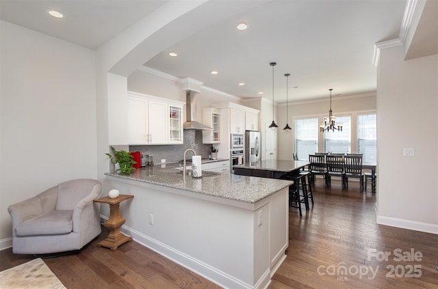 kitchen with stainless steel appliances, tasteful backsplash, dark wood-type flooring, glass insert cabinets, and a sink