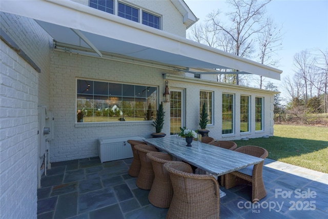 view of patio with outdoor dining area