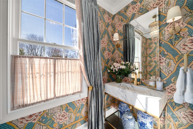 room details with a sink and wallpapered walls