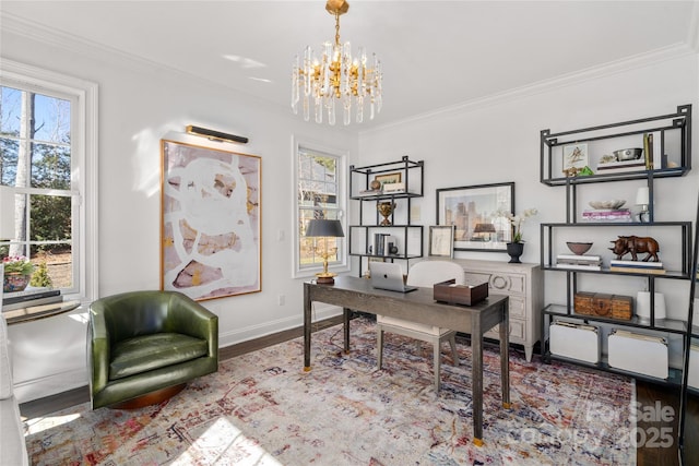 office area with a notable chandelier, ornamental molding, wood finished floors, and baseboards