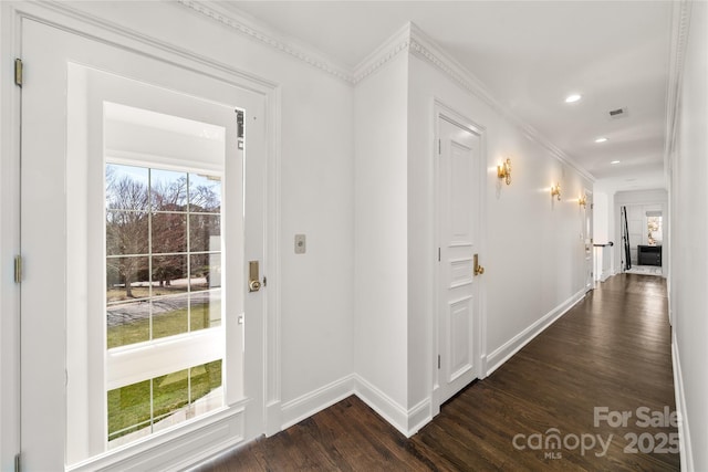 interior space with dark wood-style flooring, crown molding, recessed lighting, visible vents, and baseboards