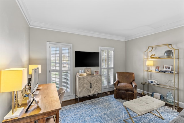 interior space featuring wood finished floors, baseboards, and ornamental molding