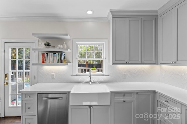 kitchen featuring stainless steel dishwasher, gray cabinetry, and ornamental molding