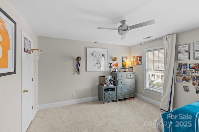 unfurnished bedroom with visible vents, baseboards, a ceiling fan, and carpet flooring