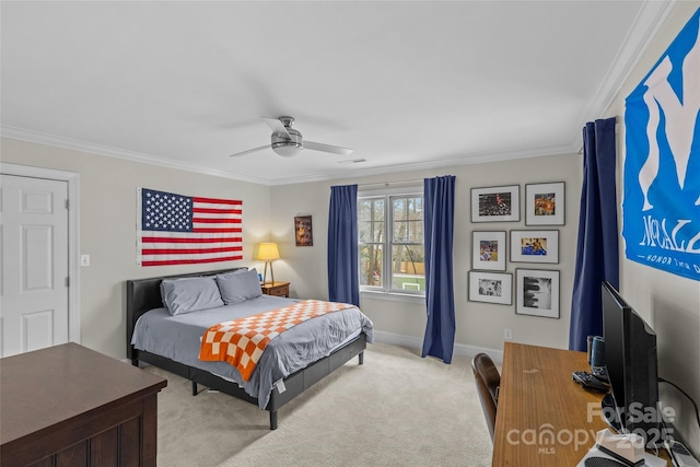 bedroom featuring light colored carpet, a ceiling fan, baseboards, and ornamental molding