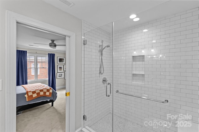 ensuite bathroom featuring ornamental molding, visible vents, connected bathroom, and a stall shower