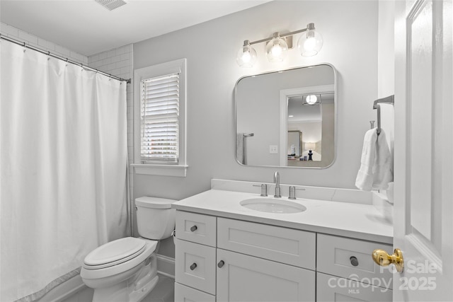 bathroom featuring a shower with curtain, baseboards, toilet, and vanity