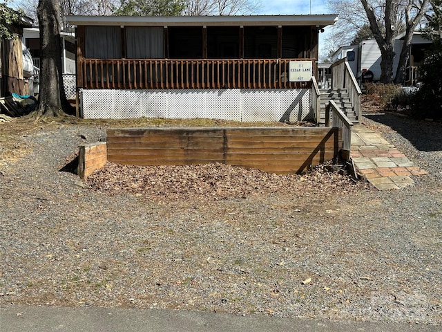 view of front of house with a sunroom