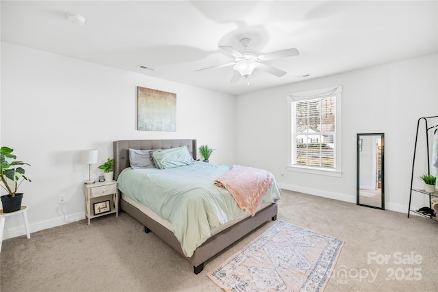 bedroom with a ceiling fan, light colored carpet, visible vents, and baseboards