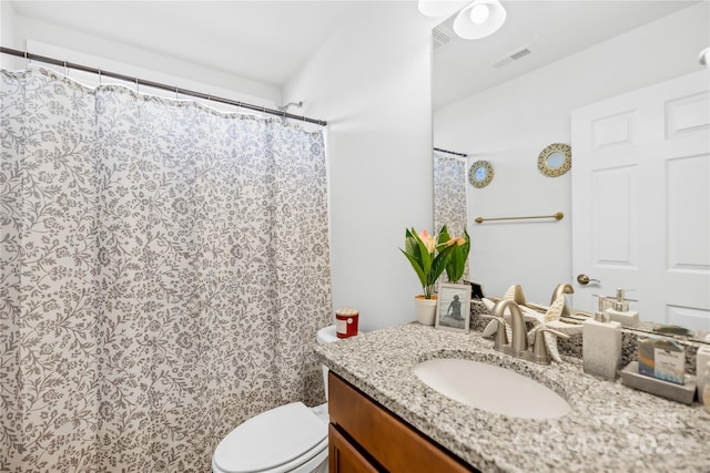 full bath featuring toilet, vanity, and visible vents