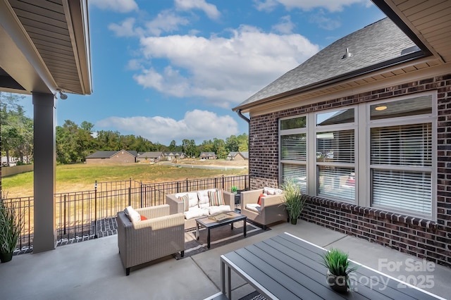 view of patio / terrace featuring fence and an outdoor living space