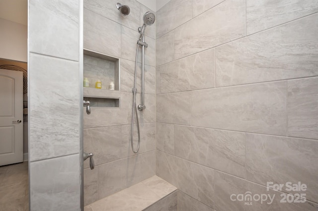 full bathroom featuring a tile shower