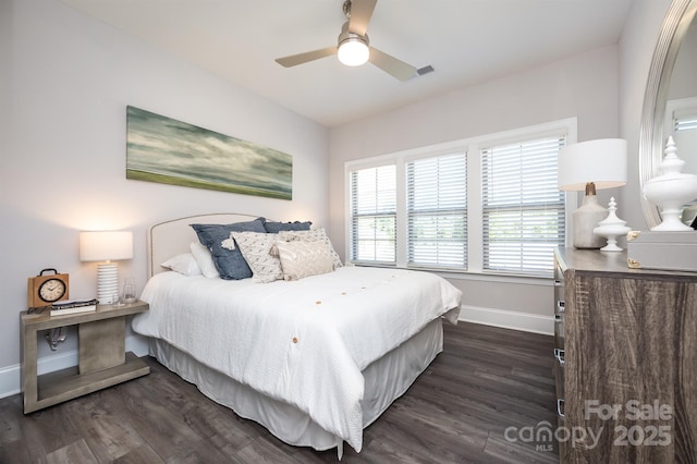 bedroom featuring dark wood-style floors, ceiling fan, and baseboards