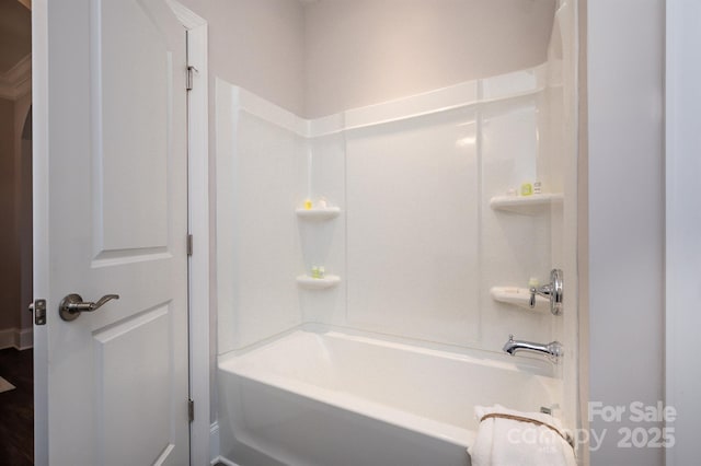 bathroom with washtub / shower combination