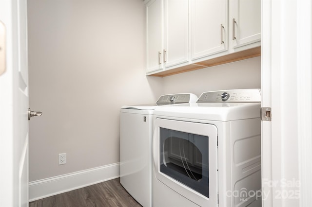 clothes washing area featuring dark wood-style floors, independent washer and dryer, cabinet space, and baseboards