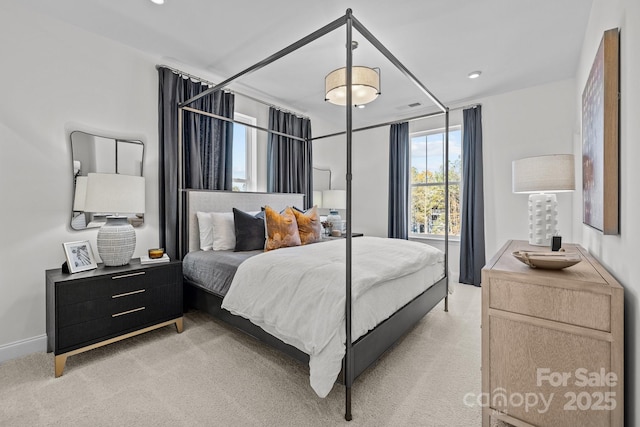 bedroom featuring recessed lighting, light carpet, and visible vents