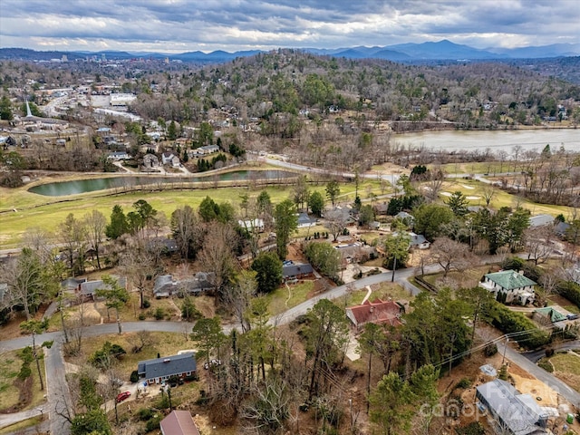 birds eye view of property featuring a water and mountain view