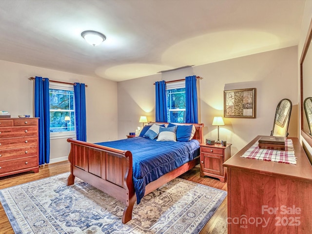 bedroom featuring wood finished floors