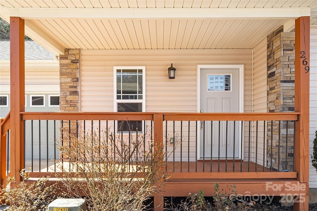 wooden terrace with a porch