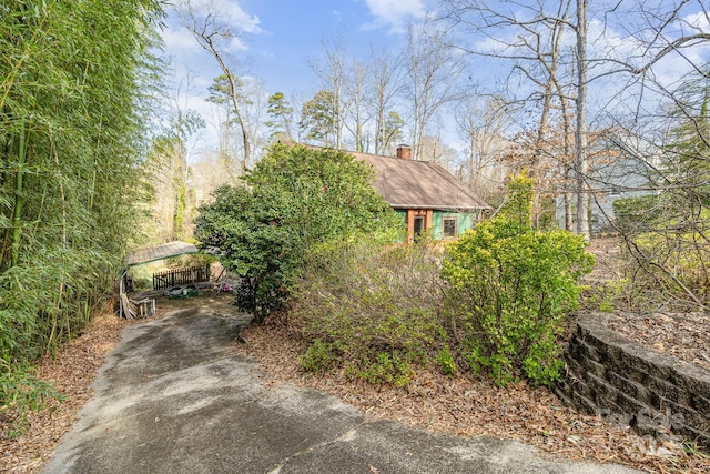 view of home's exterior with a chimney