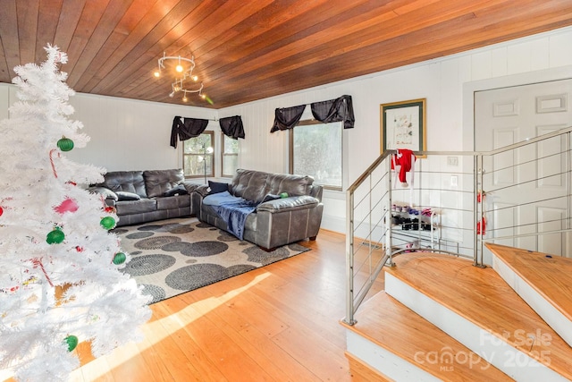 living area with a chandelier, wooden ceiling, and hardwood / wood-style floors