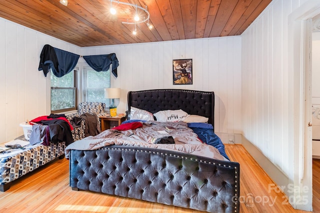 bedroom featuring wooden ceiling and wood finished floors