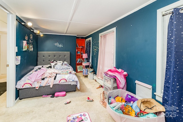 bedroom with carpet floors and crown molding