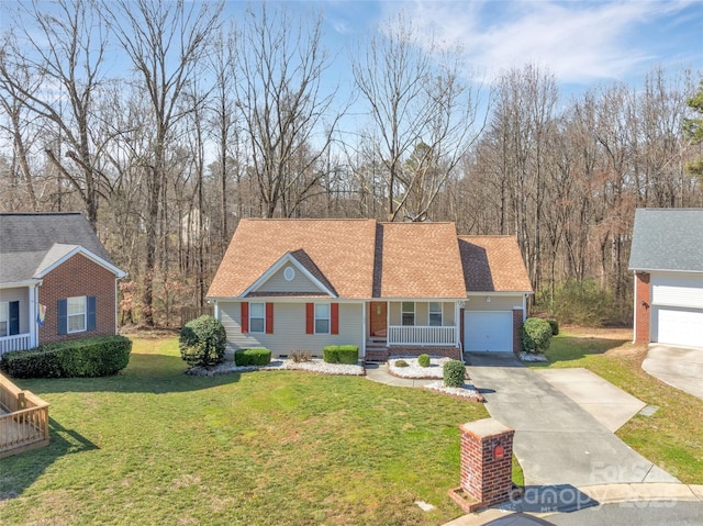 view of front of property with driveway, a shingled roof, an attached garage, a porch, and a front yard