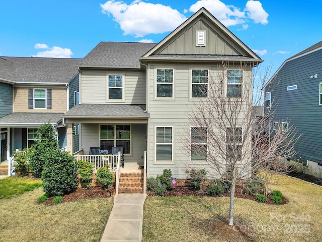 117 Stowe Rd, Belmont, NC 28012 - view of front of home featuring covered porch, a front lawn, board and batten siding, and roof with shingles