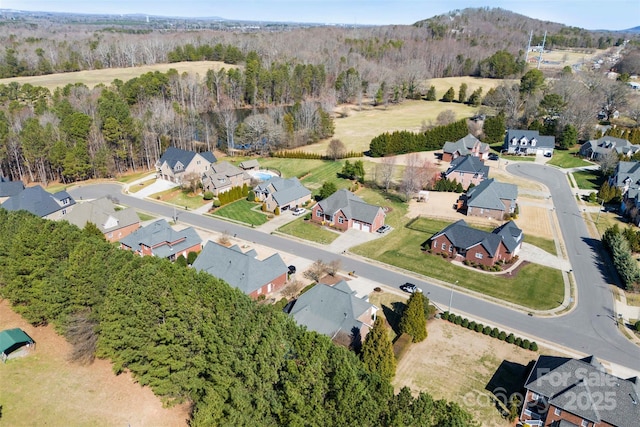 aerial view with a forest view and a residential view