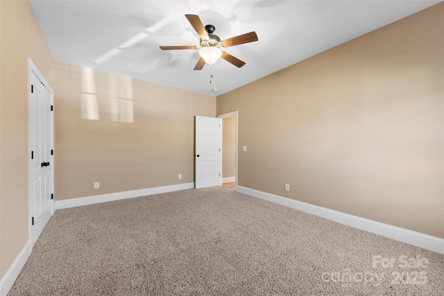 empty room with light carpet, ceiling fan, and baseboards