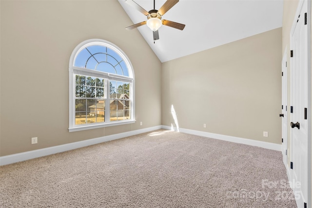 unfurnished room featuring carpet floors, high vaulted ceiling, baseboards, and a ceiling fan