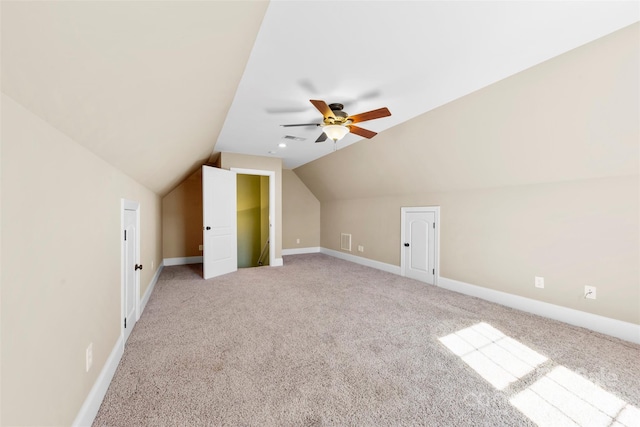 bonus room featuring light carpet, vaulted ceiling, visible vents, and baseboards