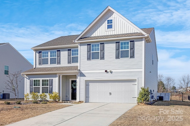 view of front of property featuring a garage, central AC, fence, driveway, and board and batten siding