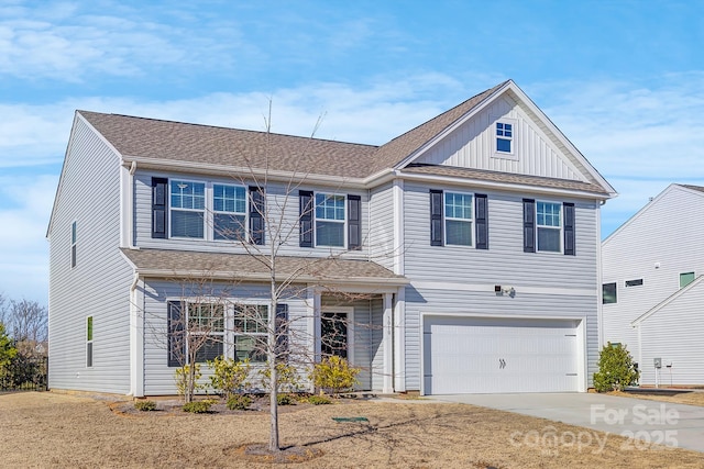 traditional home with driveway, a garage, board and batten siding, and roof with shingles