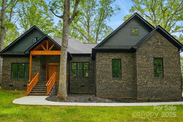 craftsman-style home featuring brick siding and a front lawn