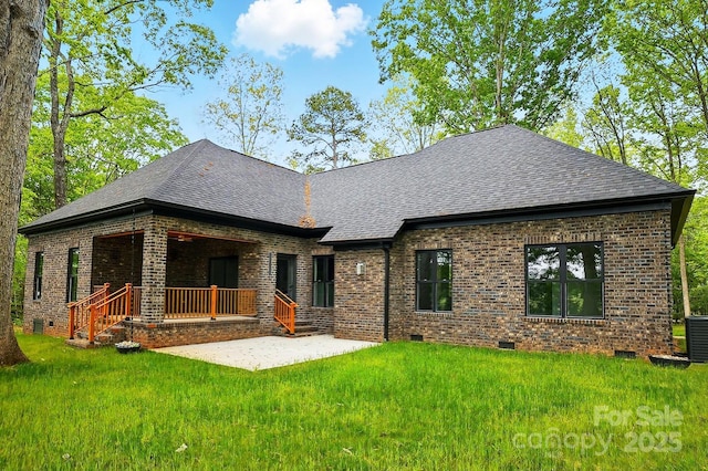 back of house with brick siding, crawl space, and roof with shingles