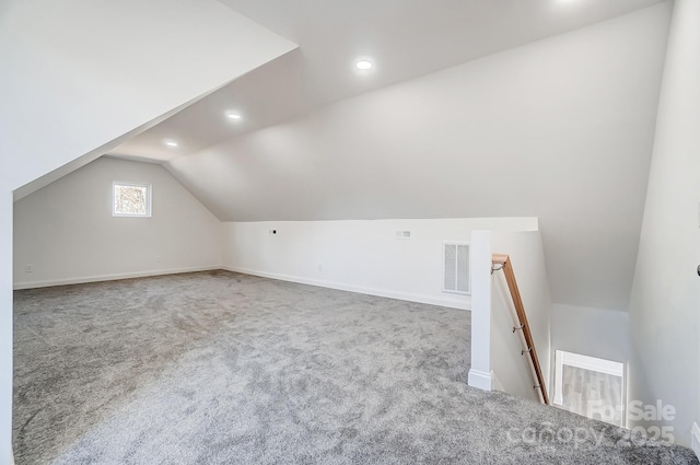 bonus room with visible vents, lofted ceiling, baseboards, recessed lighting, and carpet