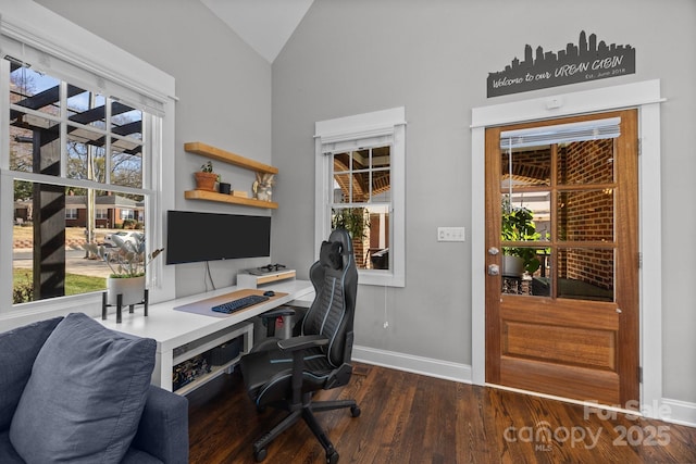 office with dark wood-style floors, a wealth of natural light, vaulted ceiling, and baseboards