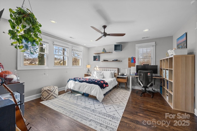 bedroom featuring recessed lighting, multiple windows, baseboards, and wood finished floors