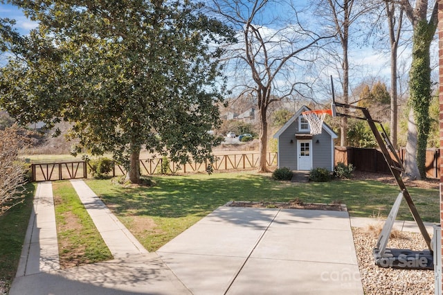 view of yard with an outbuilding and a fenced backyard