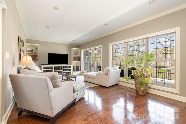 living area with dark wood finished floors, recessed lighting, crown molding, and baseboards